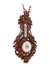 A Black Forest Carved Barometer and Thermometer