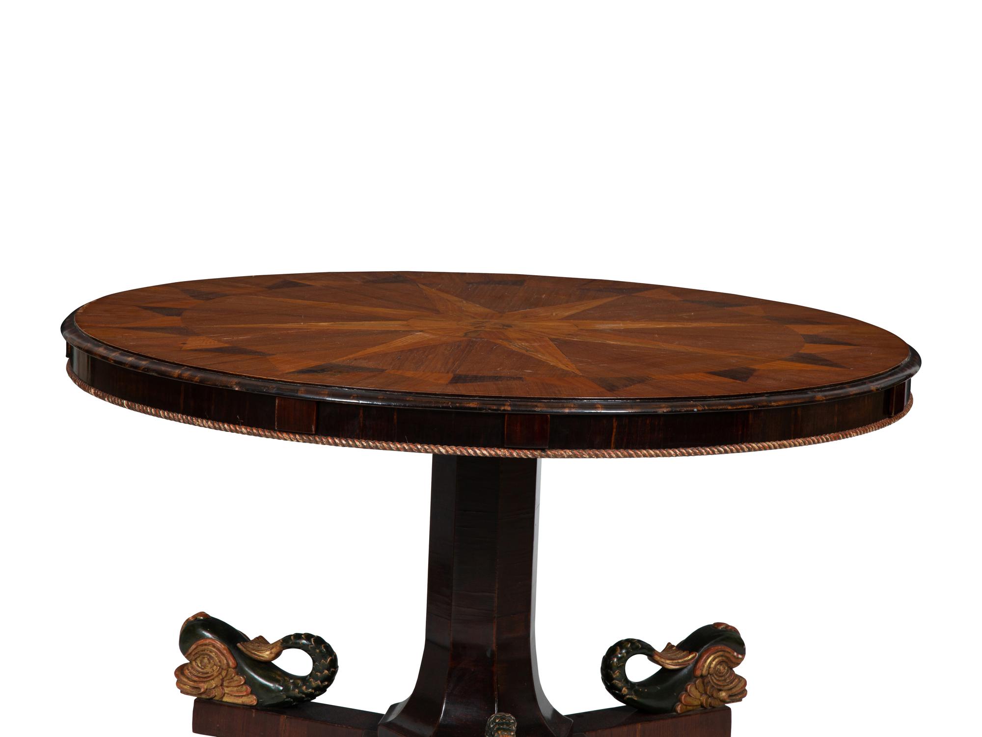An Italian Parquetry, Ebonized and Parcel Gilt Extending Dining Table
