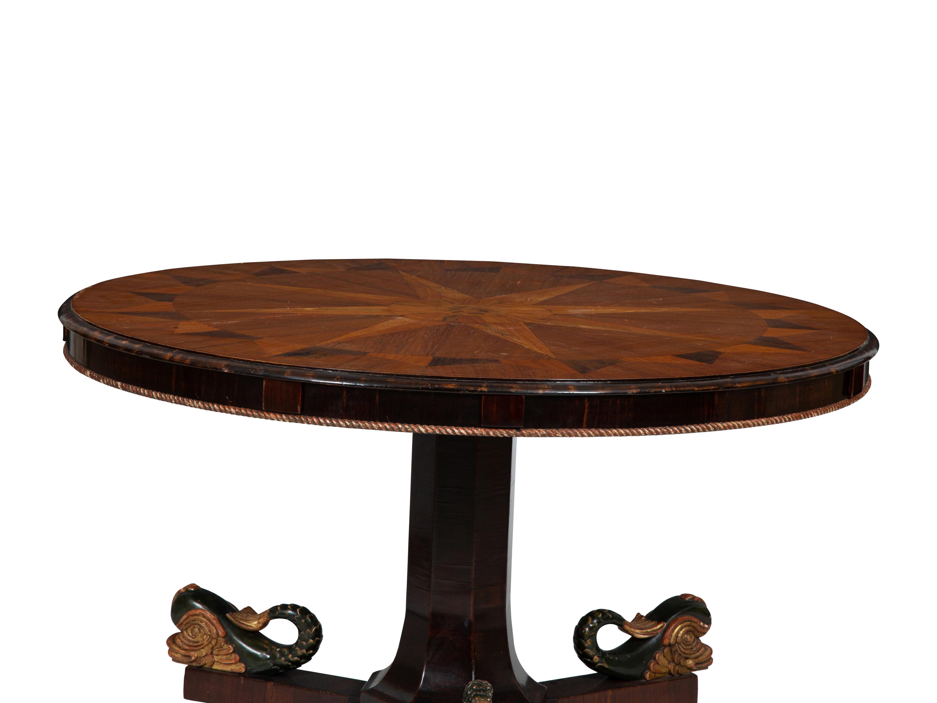 An Italian Parquetry, Ebonized and Parcel Gilt Extending Dining Table