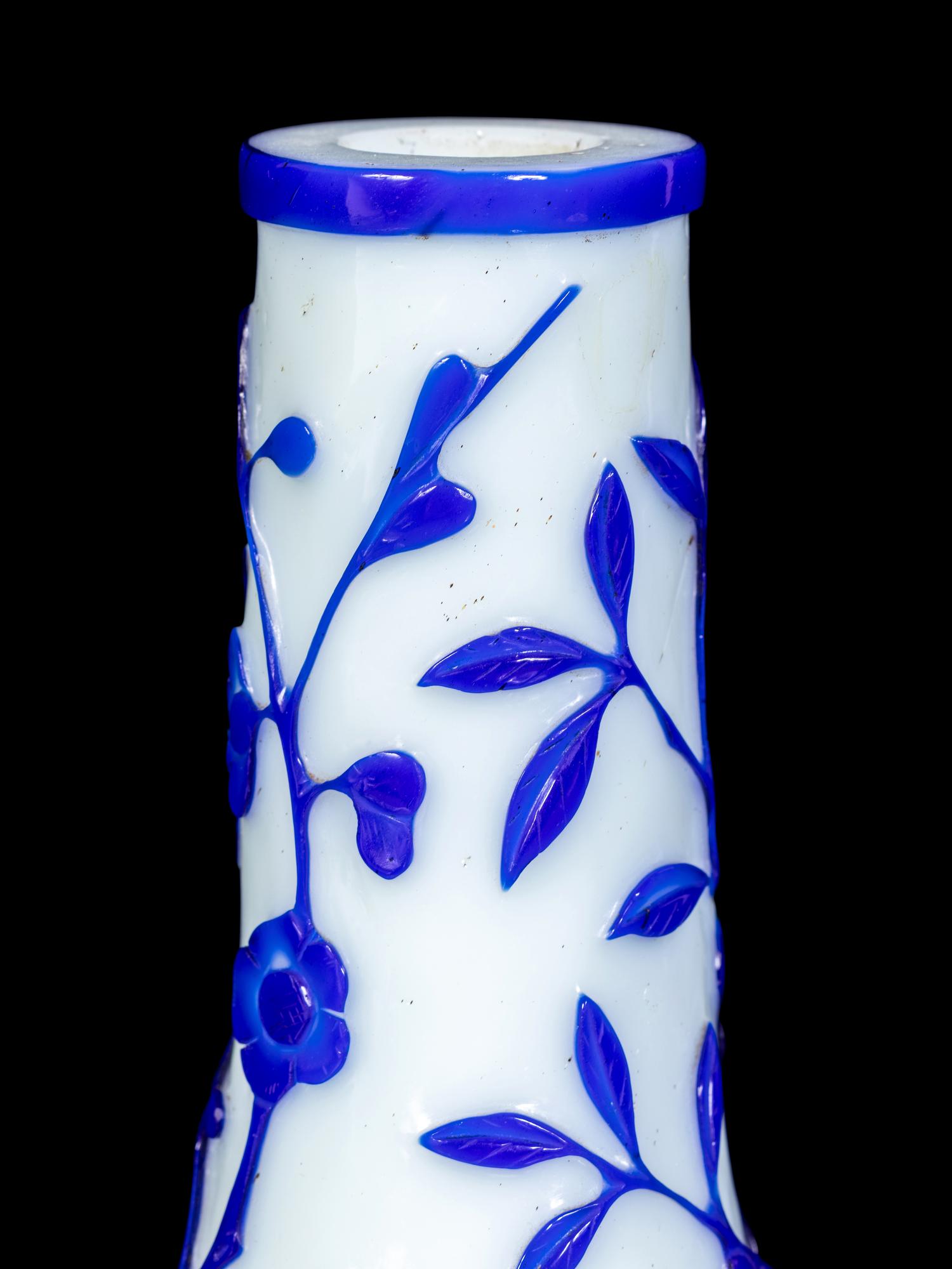 A Pair of Chinese Blue Overlay Opaque White Glass Bottle Vases