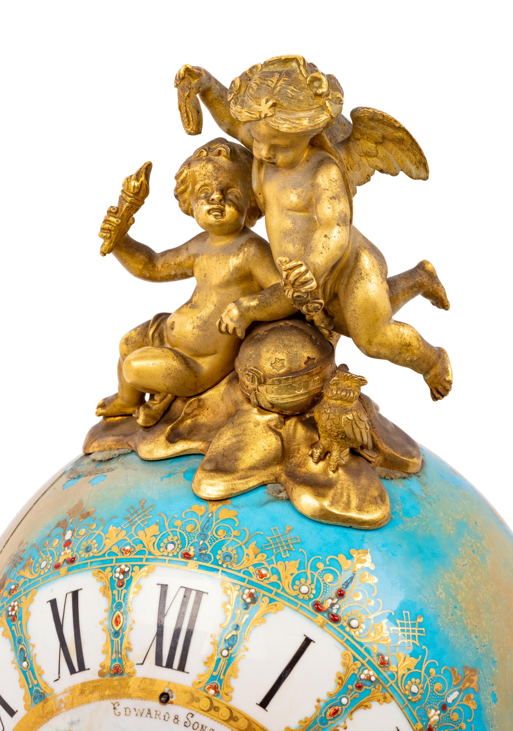 A Sèvres Style Porcelain and Gilt Bronze Mounted Three-Piece Clock Garniture