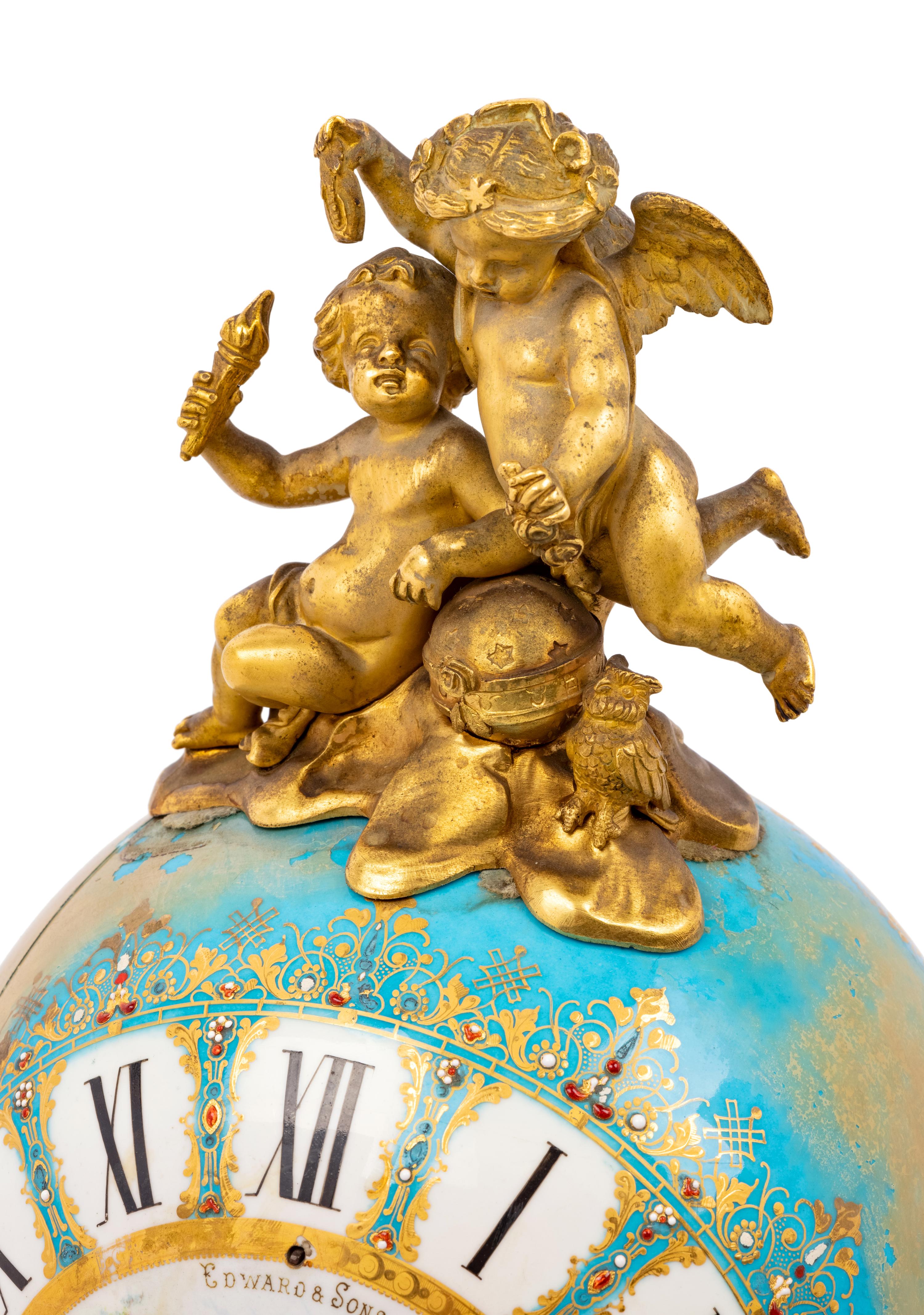 A Sèvres Style Porcelain and Gilt Bronze Mounted Three-Piece Clock Garniture