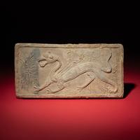 A Chinese Grey Pottery 'White Tiger' Relief Tomb Brick, Southern Dynasties — 南朝 灰陶四神白虎畫像磚