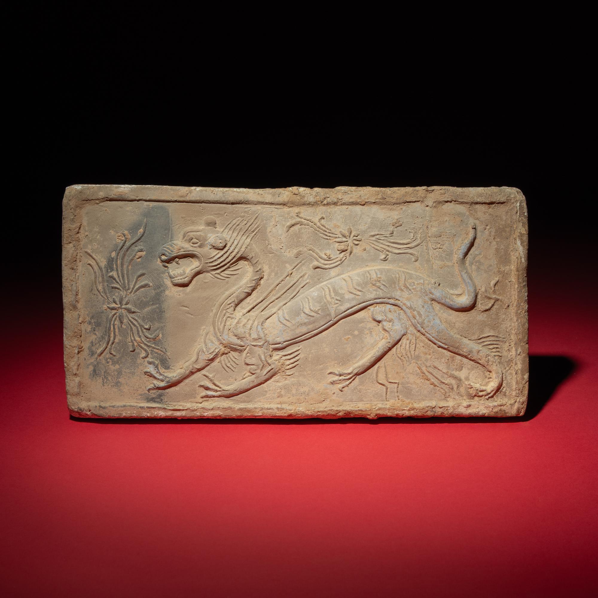 A Chinese Grey Pottery 'White Tiger' Relief Tomb Brick, Southern Dynasties — 南朝 灰陶四神白虎畫像磚