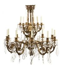 A Neoclassical Gilt Bronze Sixteen-Light Chandelier, Height 37 x diameter 36 inches.