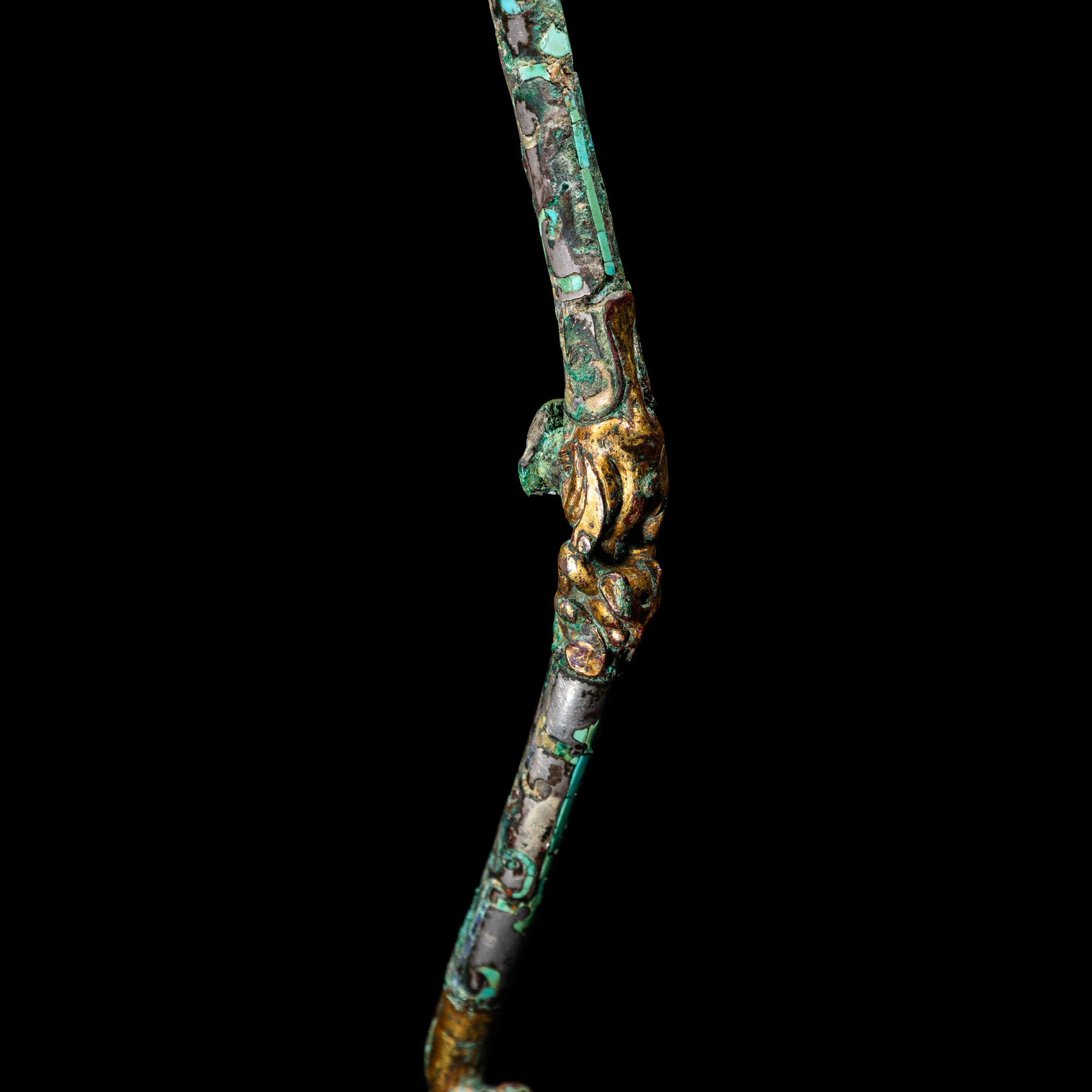 A Chinese Gilt, Silvered and Turquoise Inlaid Bronze Belt Hook, Warring States Period 戰國 銅 鎏金錯銀嵌松石雙獸首帶鉤