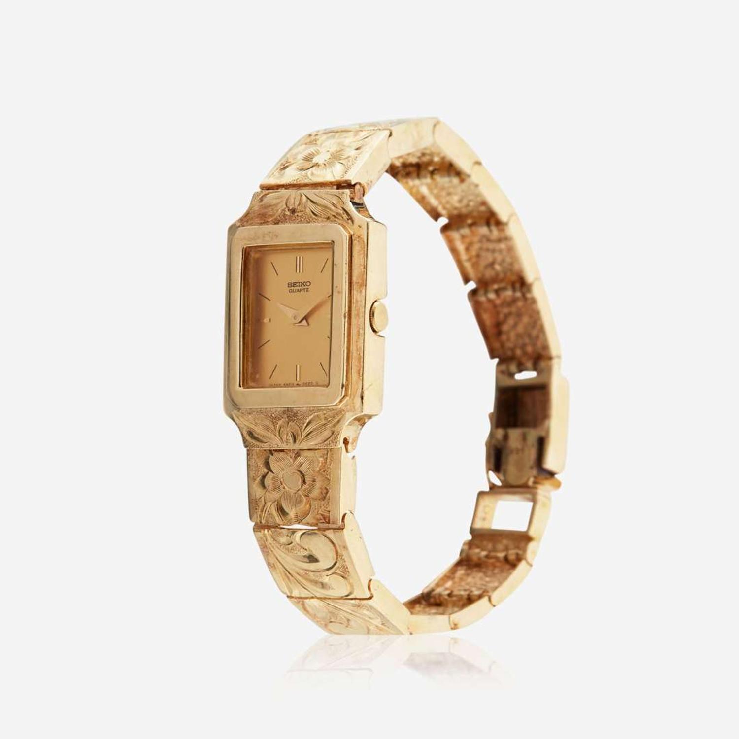 A gold bracelet watch and matching earrings, Seiko