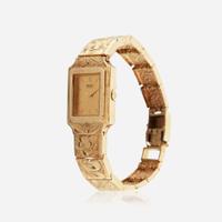A gold bracelet watch and matching earrings, Seiko