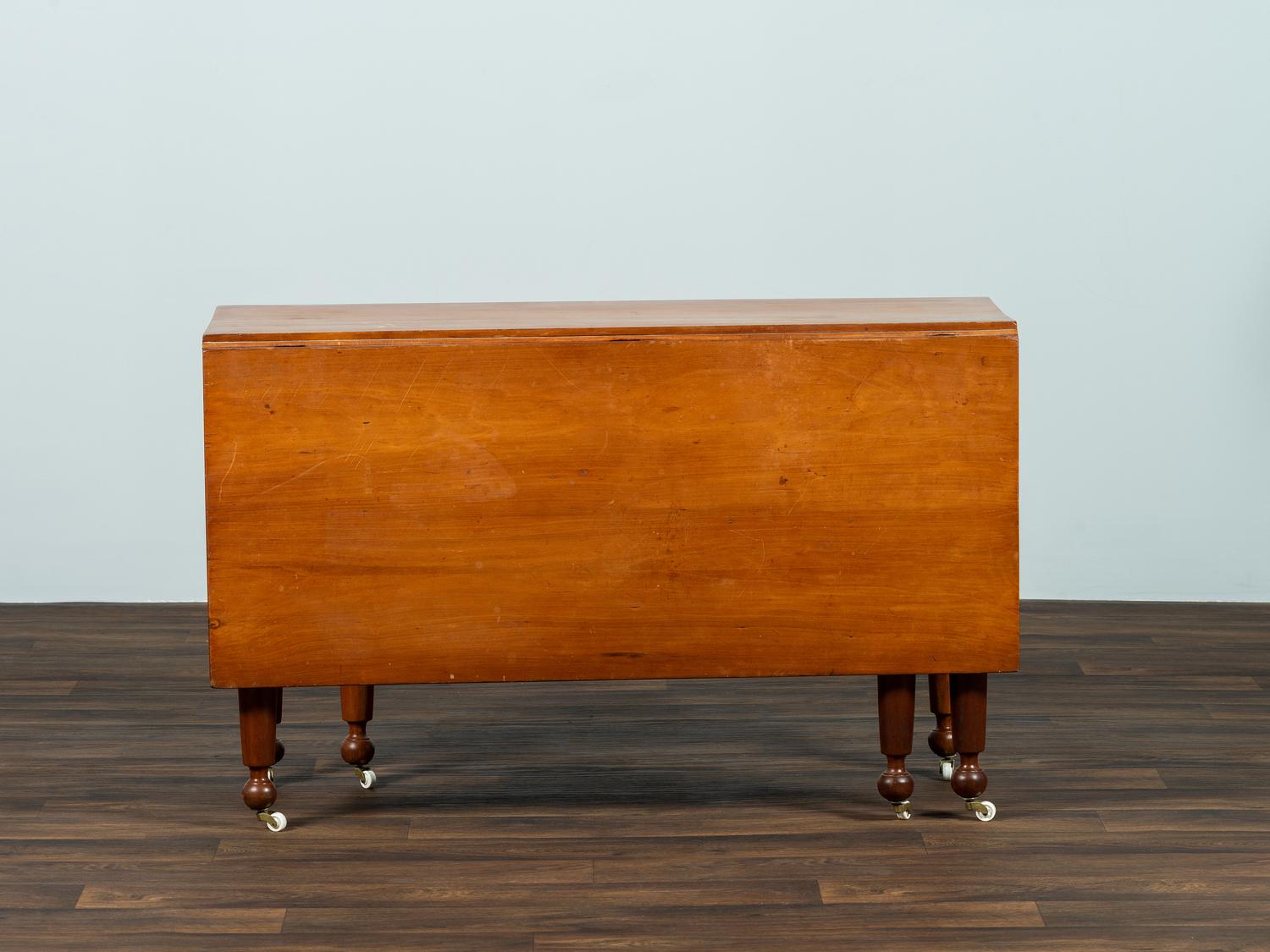 A Late Federal Cherrywood Drop-Leaf Dining Table (Please send consignor donation receipt once donated)