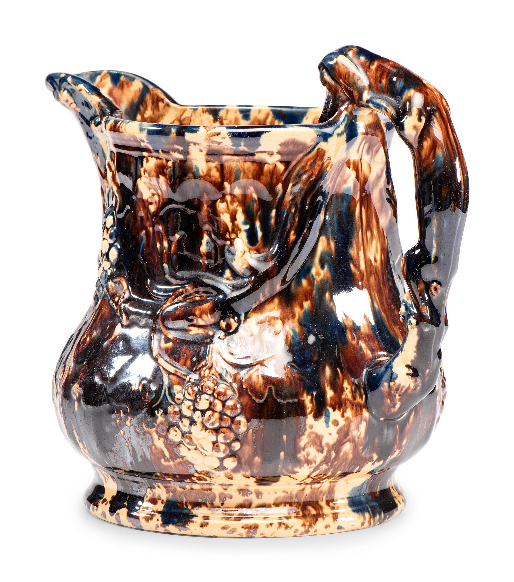 A Large Yellowware Pitcher with Spectacular Blue Flint Enamel Glaze