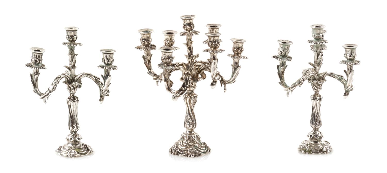 A Group of Three Silver Candelabra, Harry Smith, Perrysville, IN, comprising a seven-light example and two four-light examples.