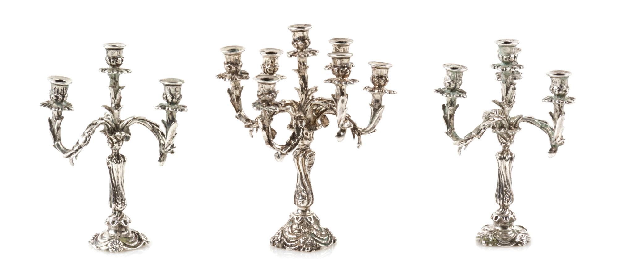 A Group of Three Silver Candelabra, Harry Smith, Perrysville, IN, comprising a seven-light example and two four-light examples.