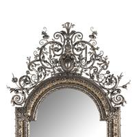 A Baroque Style Silvered Wrought Iron Mirror