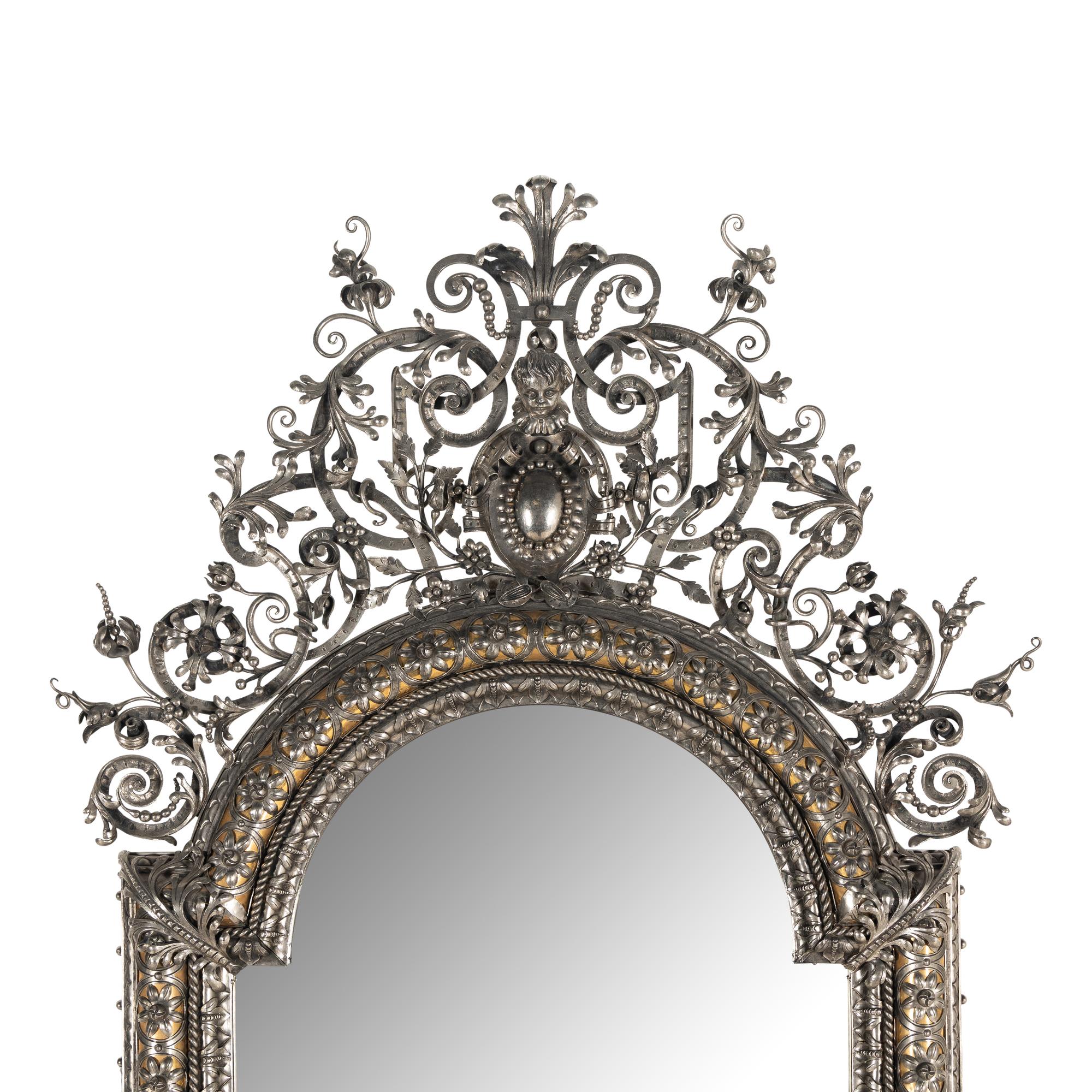 A Baroque Style Silvered Wrought Iron Mirror