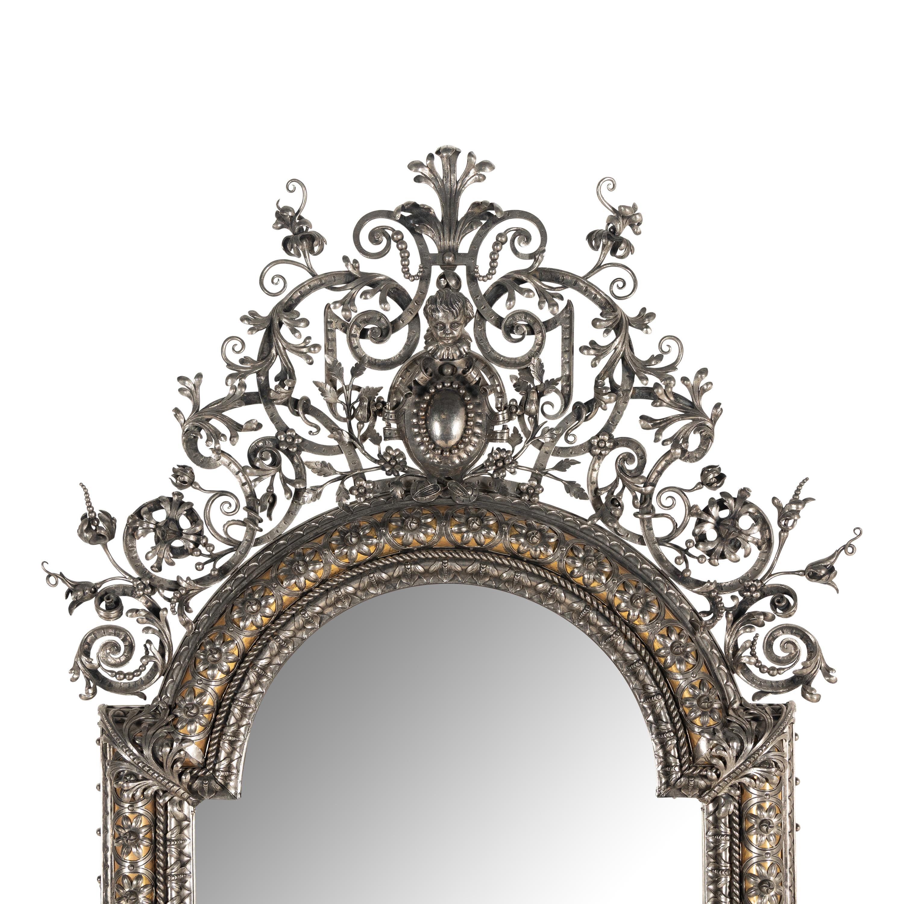 A Baroque Style Silvered Wrought Iron Mirror
