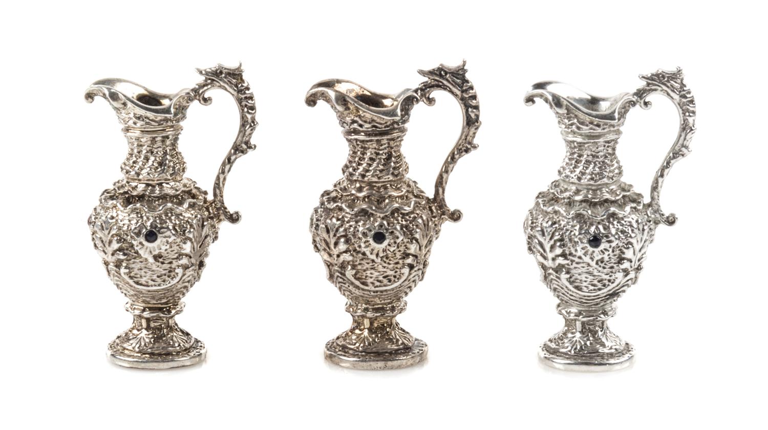 Three Jewel-Inset Silver Ewers, Harry Smith, Perrysville, IN, each having a serpentine handle.