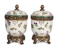 A Pair of United Wilson Gilt Metal Mounted Porcelain Urns