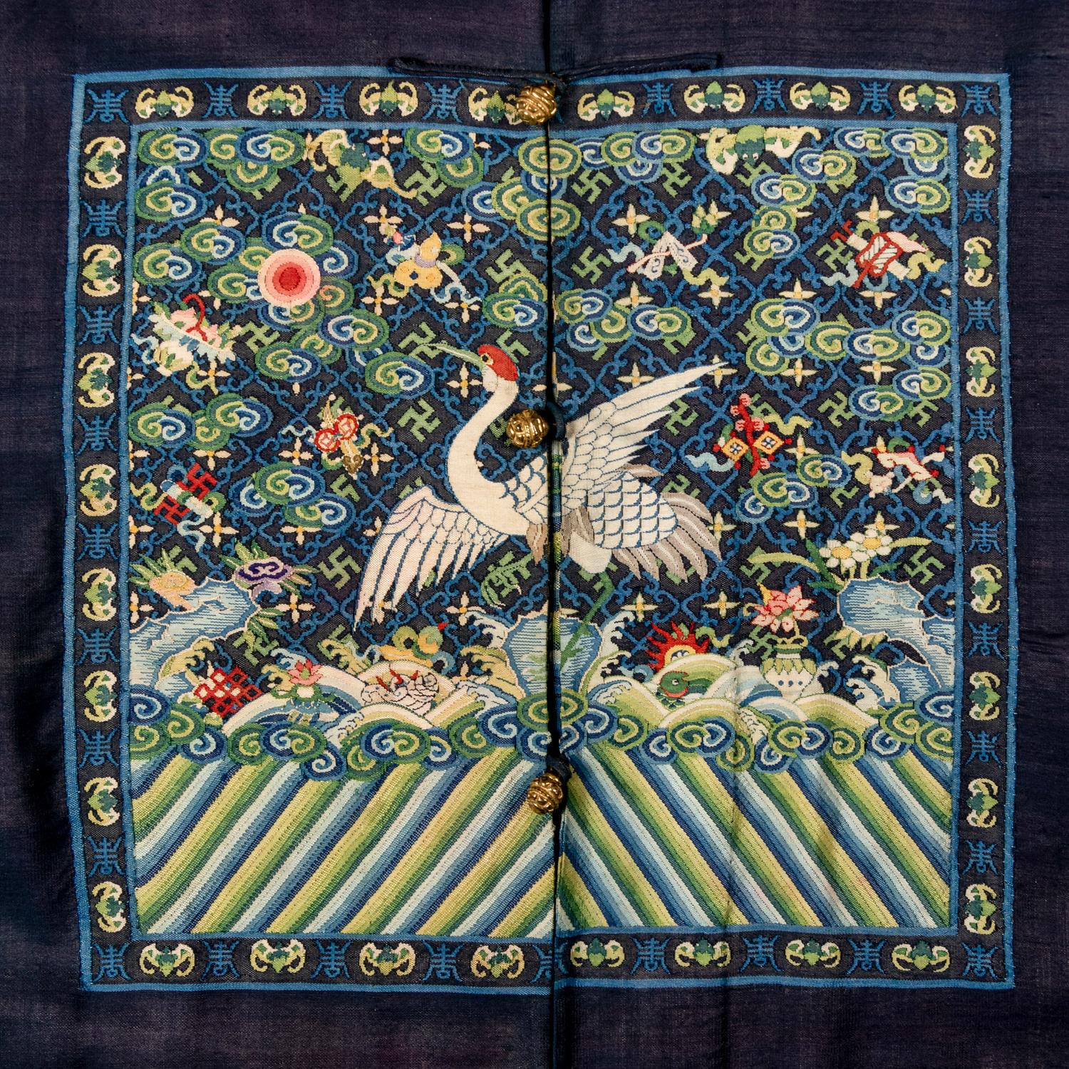 A Chinese Navy Blue Ground Official's Surcoat, Bufu, and A Velvet-Brimmed Winter Hat, Jiguan, 19th Century 清中晚期 藍地一品文官補服及冬吉冠一頂