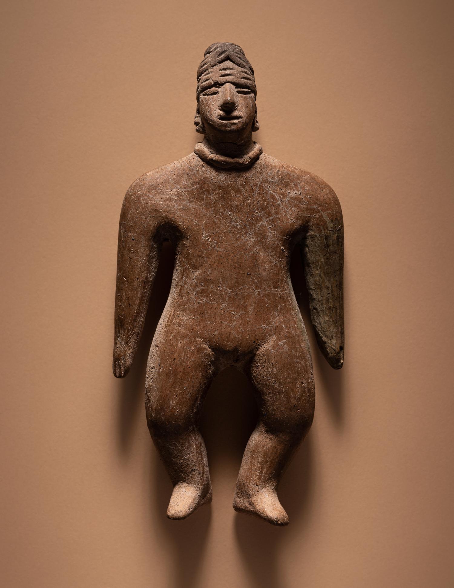 A Colima Standing Female Figure