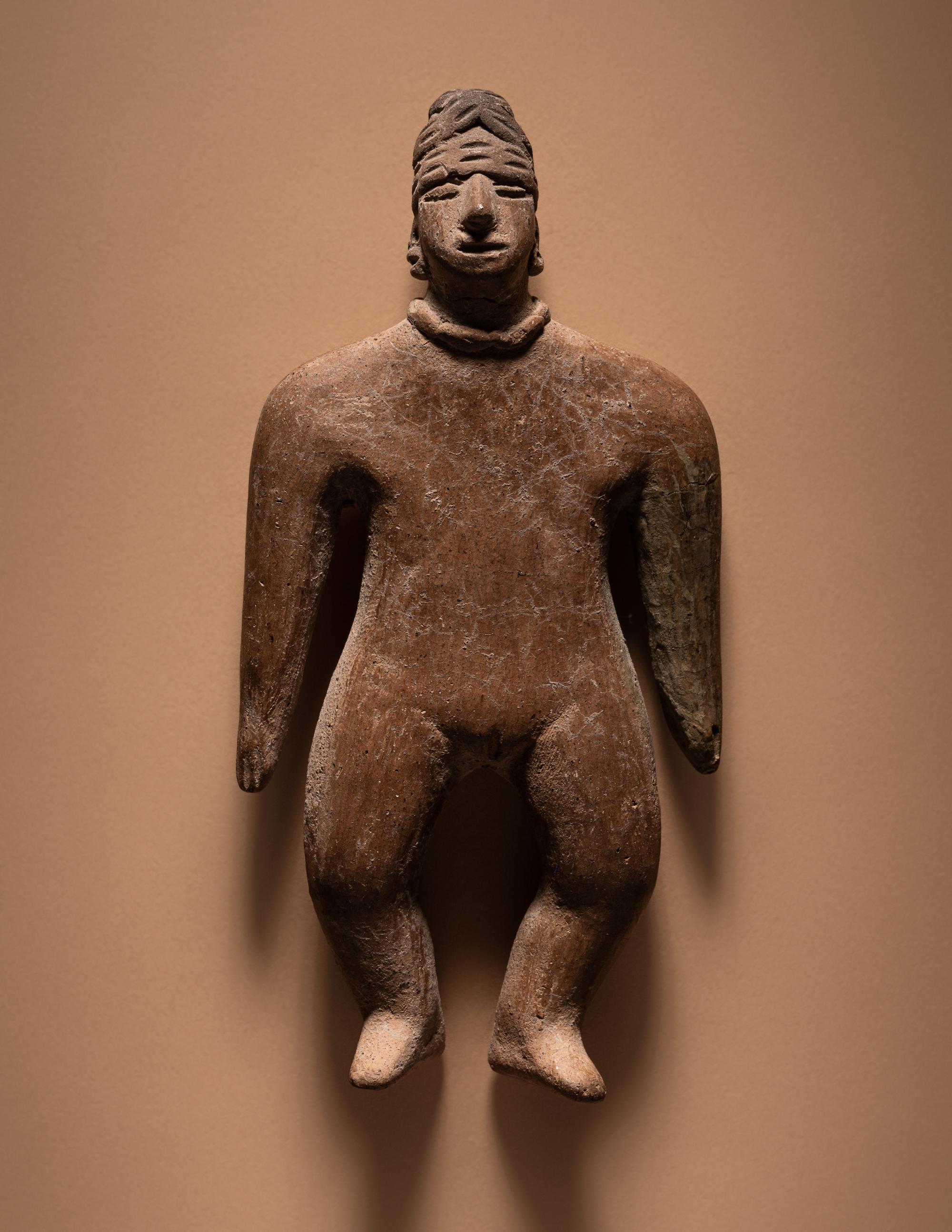 A Colima Standing Female Figure