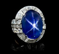 A Platinum, Burmese Star Sapphire and Diamond Ring, 12.70 dwts.