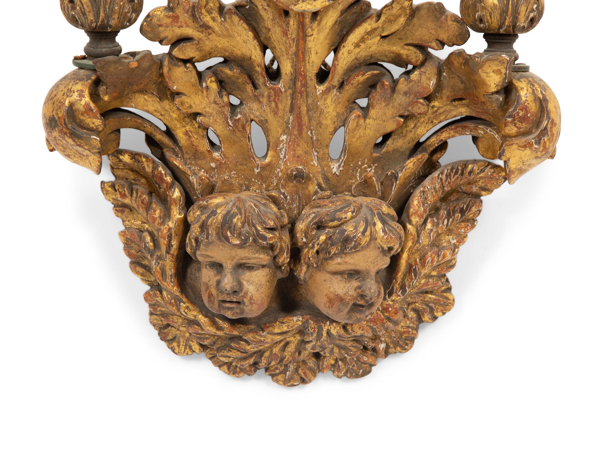 An Italian Baroque Style Giltwood Three Light Wall Sconce