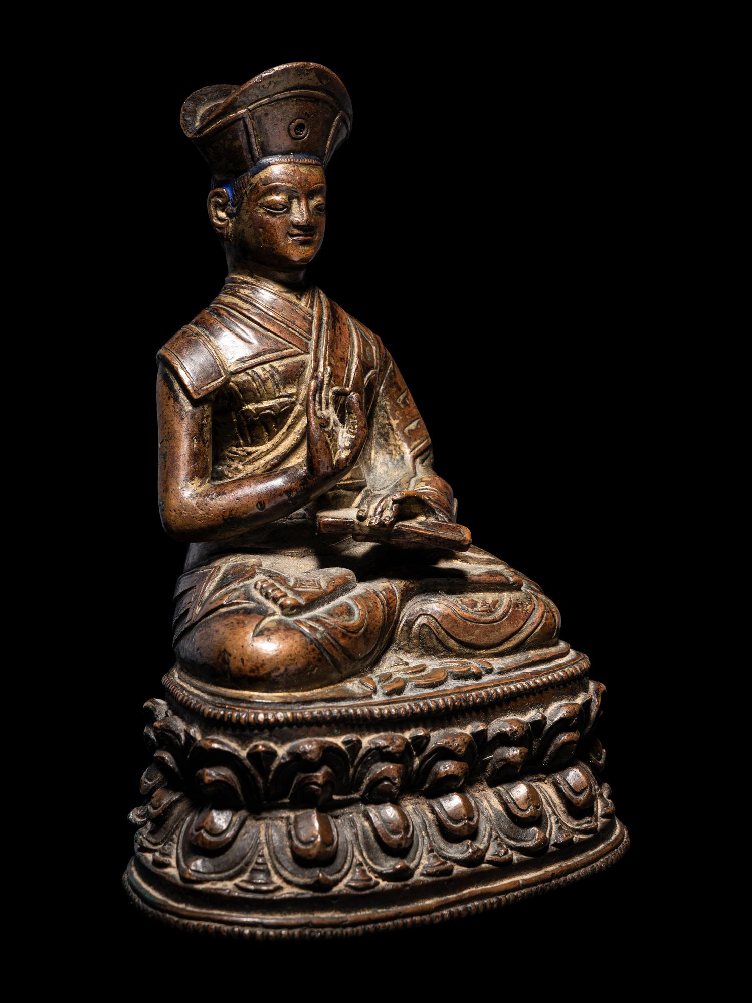 A Tibetan Bronze Figure of a Lama