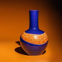 A Large Chinese Gilt and Iron Red Highlighted Blue Glazed Porcelain 'Ribbon-Tied' Vase, Tianqiuping, Late Qing Dynasty/Early Republic Period 晚清/民國 藍地描金包袱式天球瓶