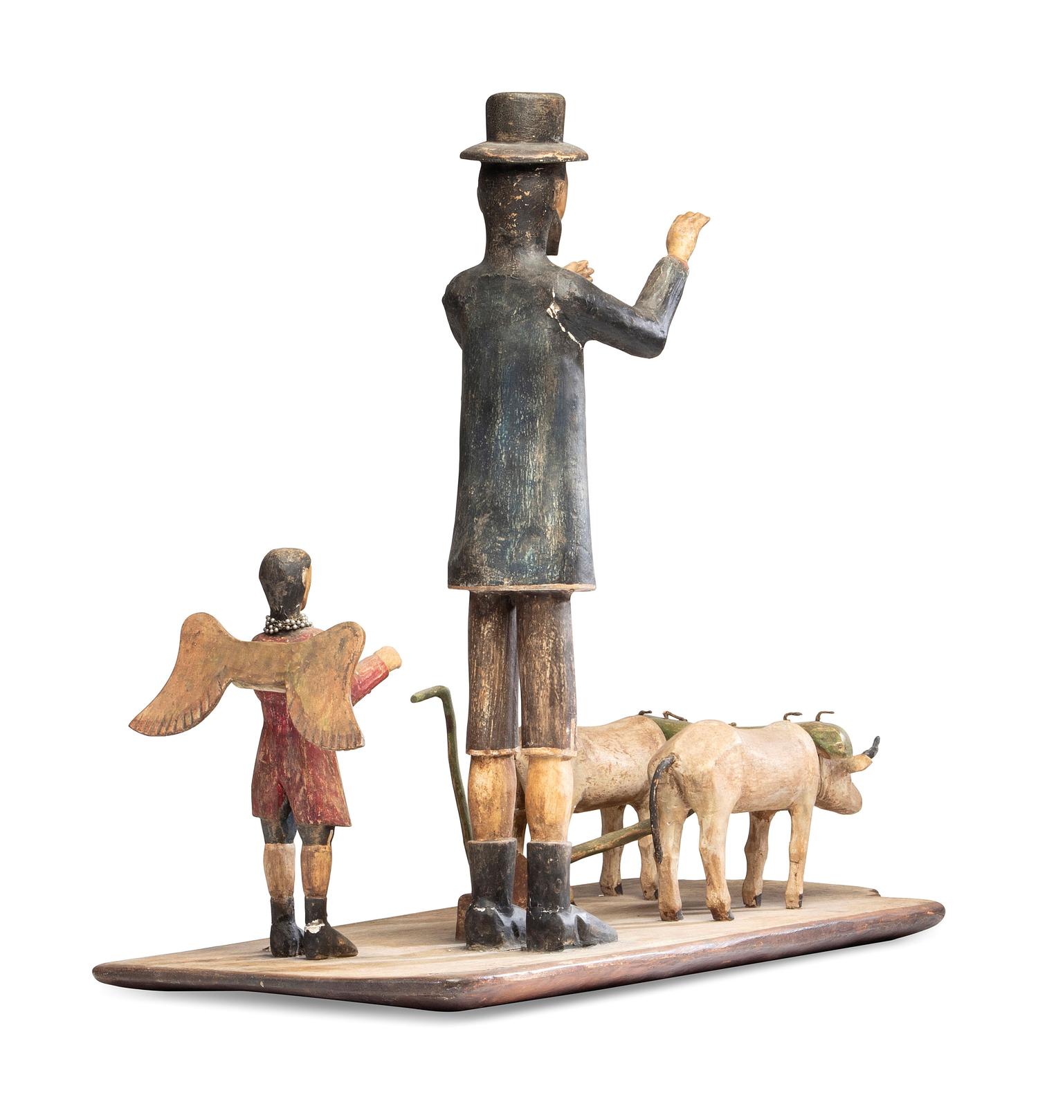 A Carved and Painted New Mexican Bulto of Saint Isidore