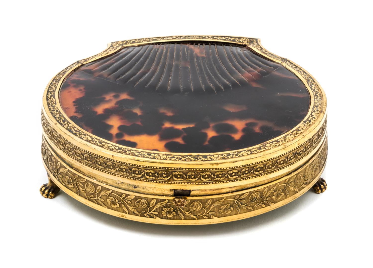 A Palais Royal Gilt Metal Mounted Tortoise Shell Sewing Kit, , the scallop form case having a tortoise shell inset lid with a gilt meta