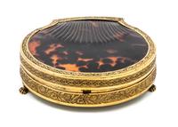 A Palais Royal Gilt Metal Mounted Tortoise Shell Sewing Kit, , the scallop form case having a tortoise shell inset lid with a gilt meta
