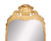 A George I giltwood and gesso looking glass, early 18th century