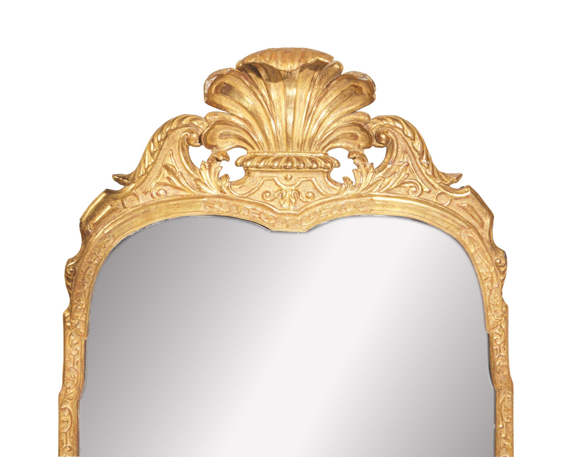 A George I giltwood and gesso looking glass, early 18th century