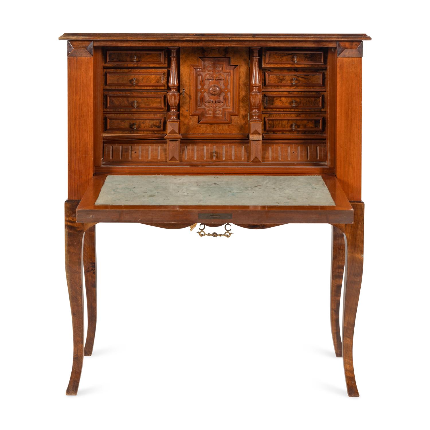 A Continental Carved and Figured Walnut Bureau