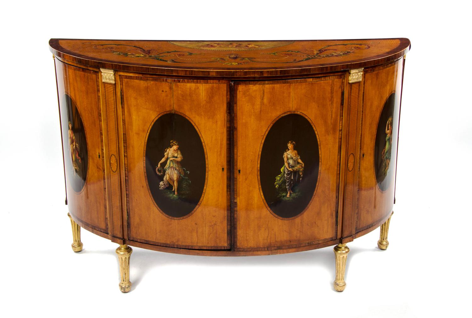A George III Adam's Style Painted Satinwood Demi-Lune Credenza, LATE 18TH/EARLY 19TH CENTURY, Height 38 x width 58 x depth 25 inches. — LATE 18TH/EARLY 19TH CENTURY,