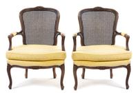 A Pair of Louis XV Style Walnut Fauteuils Height 37 inches.