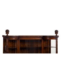 A Carved Oak Vitrine Cabinet and Open Bookshelf