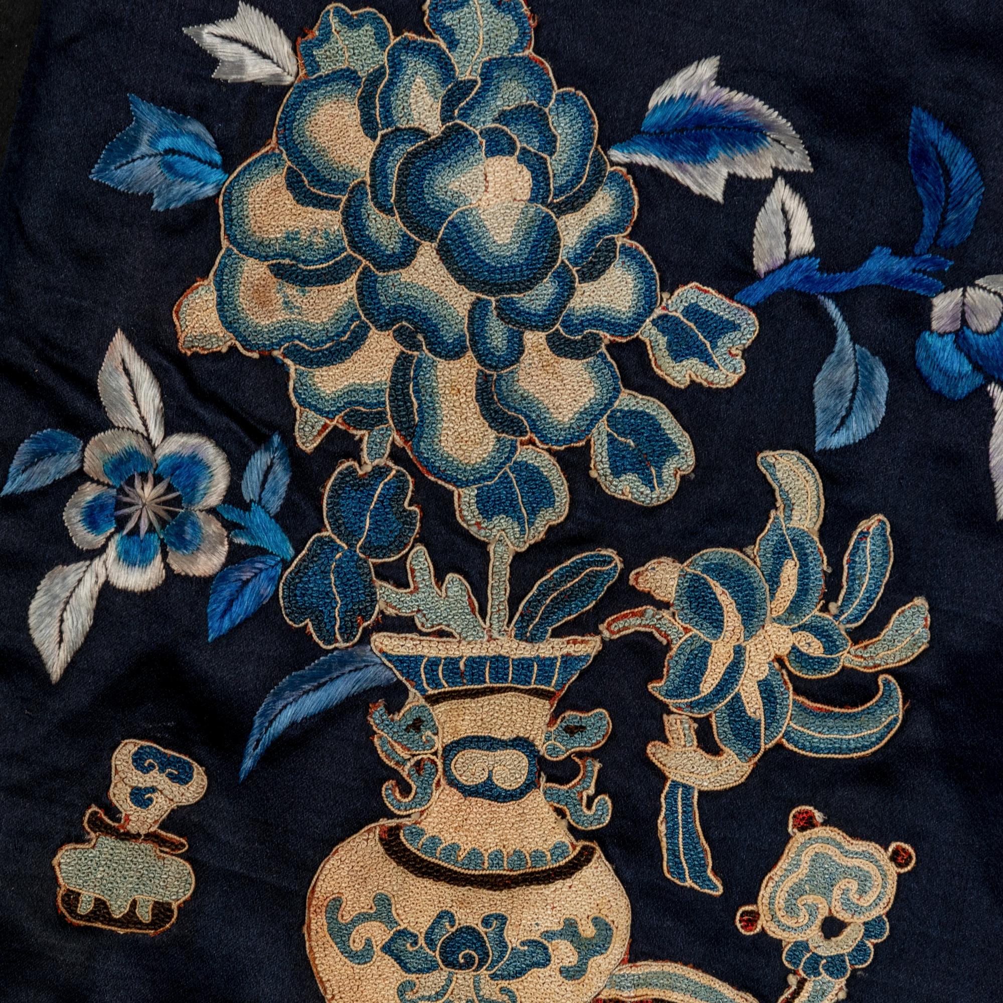 Two Chinese Midnight-Blue Ground Embroidered Silk Lady's Robes, 19th Century 清晚期 石青地綉花女褂兩件