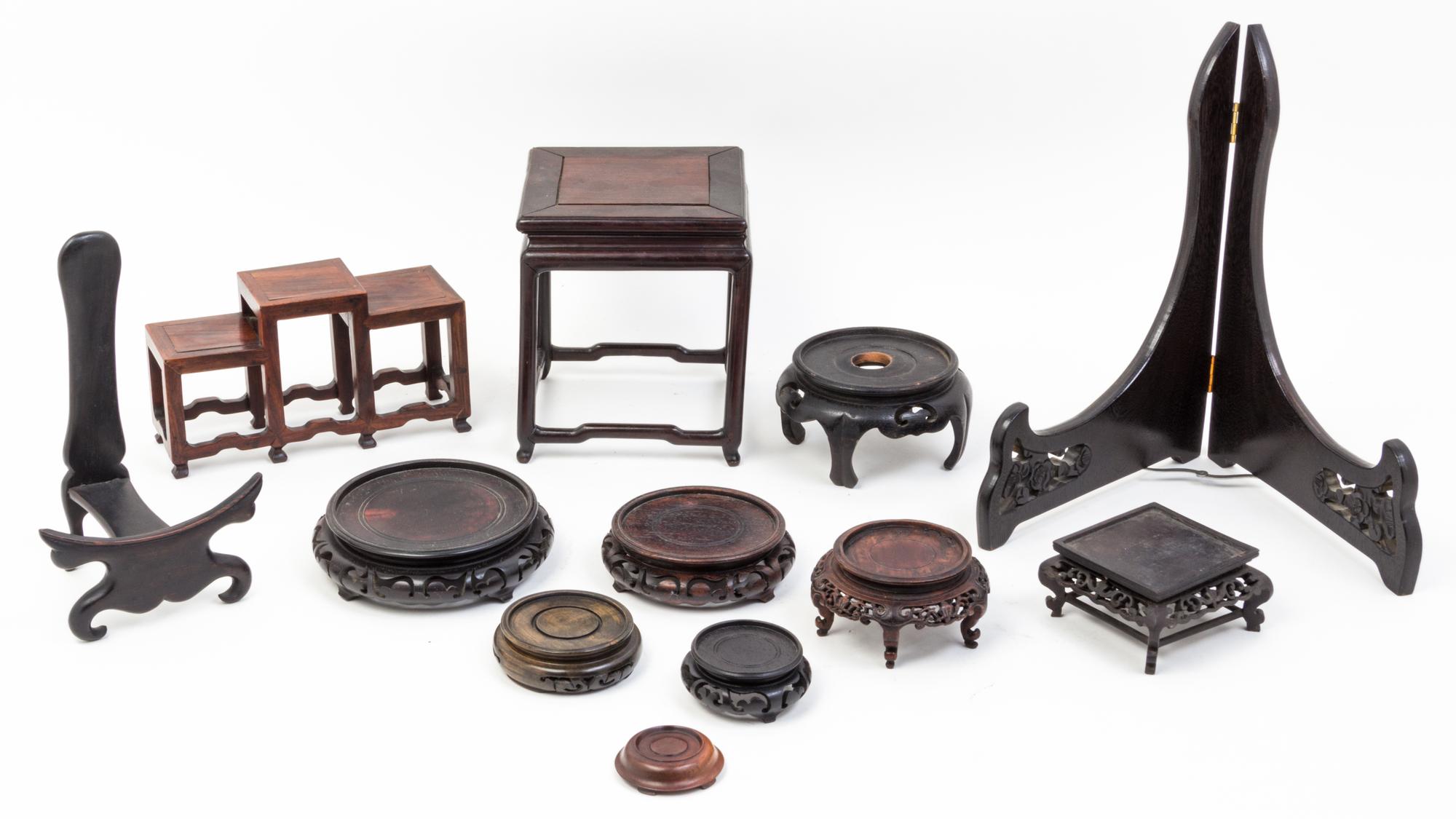 A Collection of Thirty-Four Hardwood Stands.