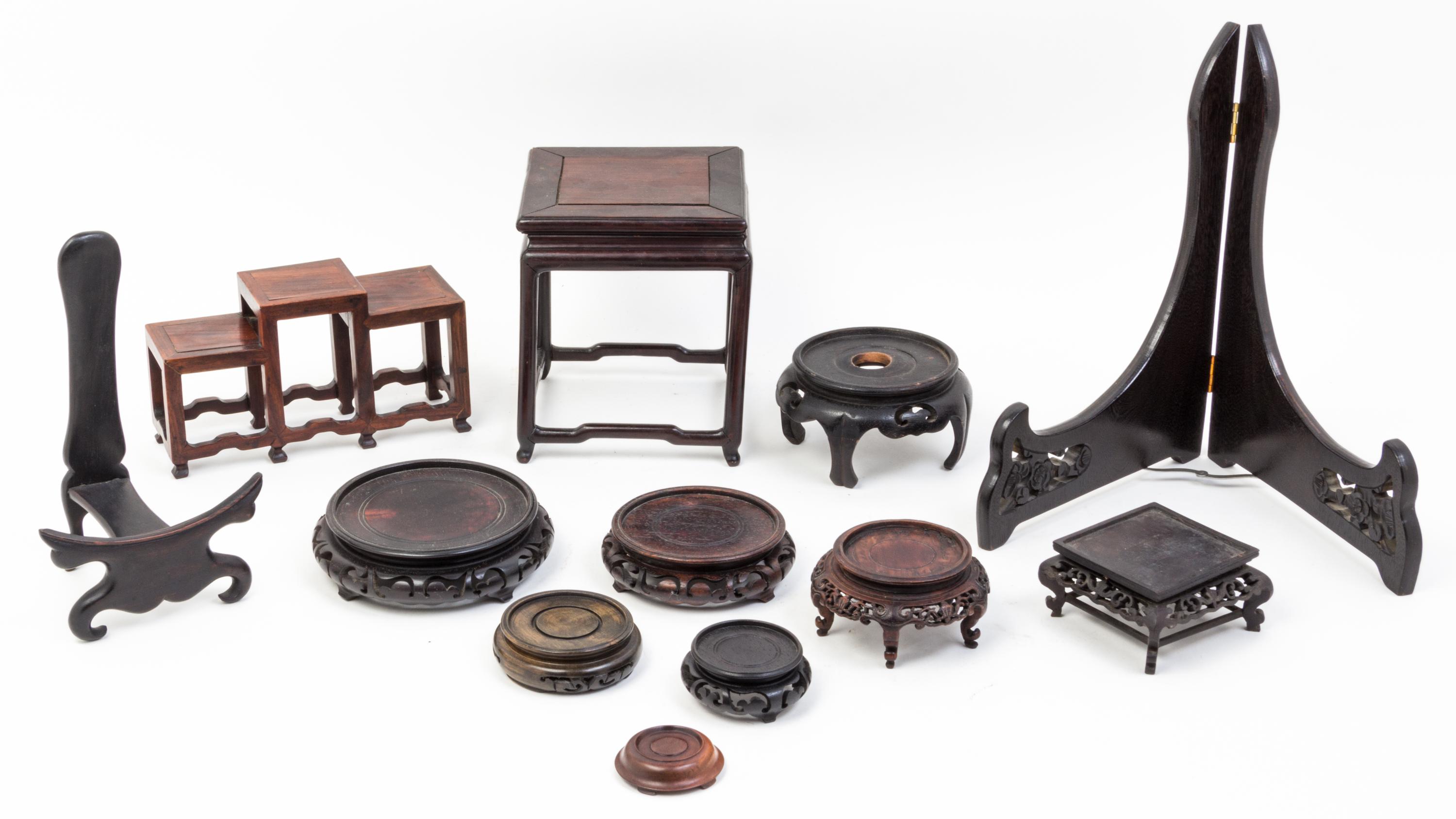 A Collection of Thirty-Four Hardwood Stands.