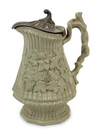 A Collection of Eight English Salt Glazed Relief Form Pitchers and Molded Earthenware — 19TH CENTURY