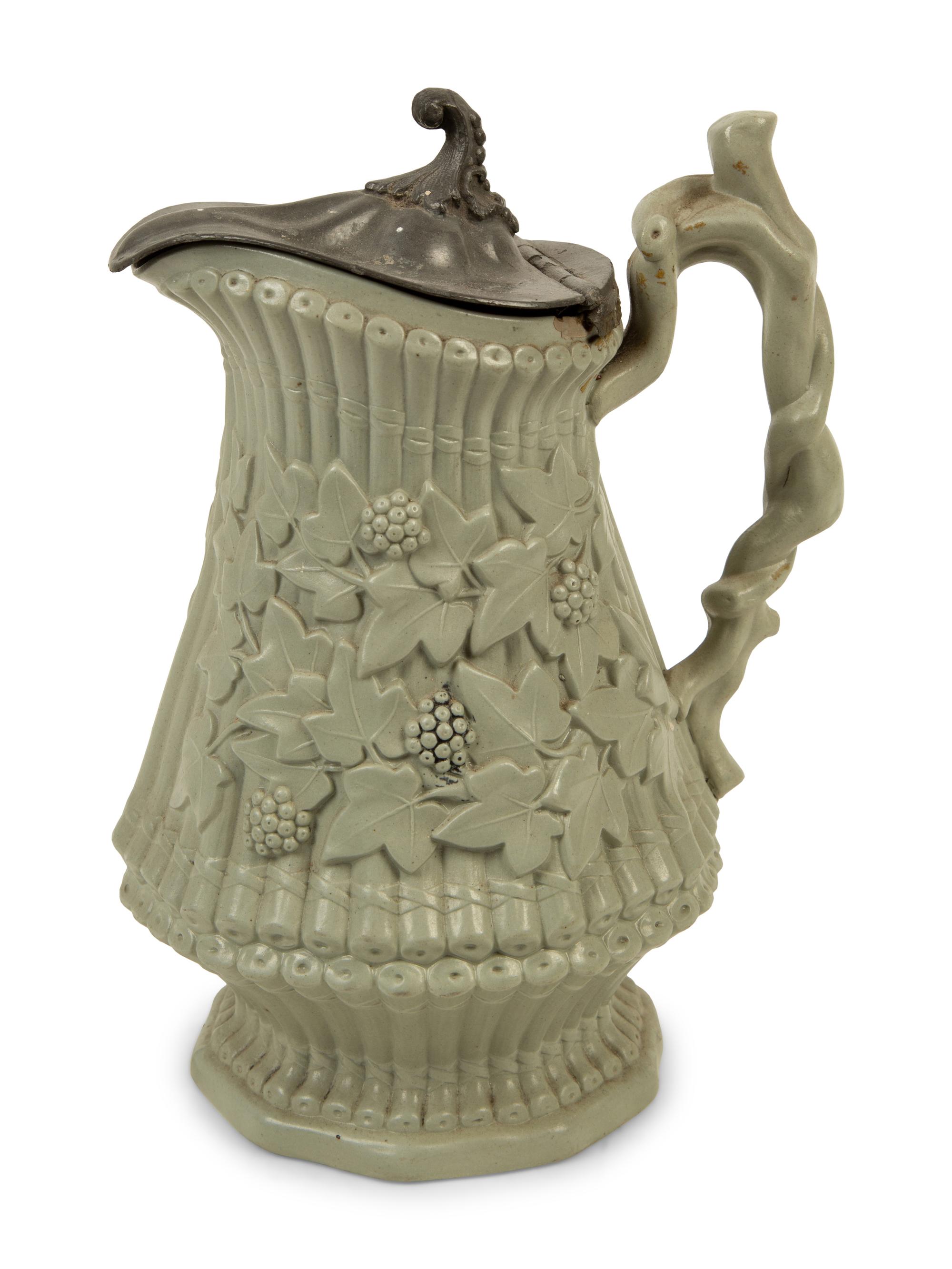 A Collection of Eight English Salt Glazed Relief Form Pitchers and Molded Earthenware — 19TH CENTURY