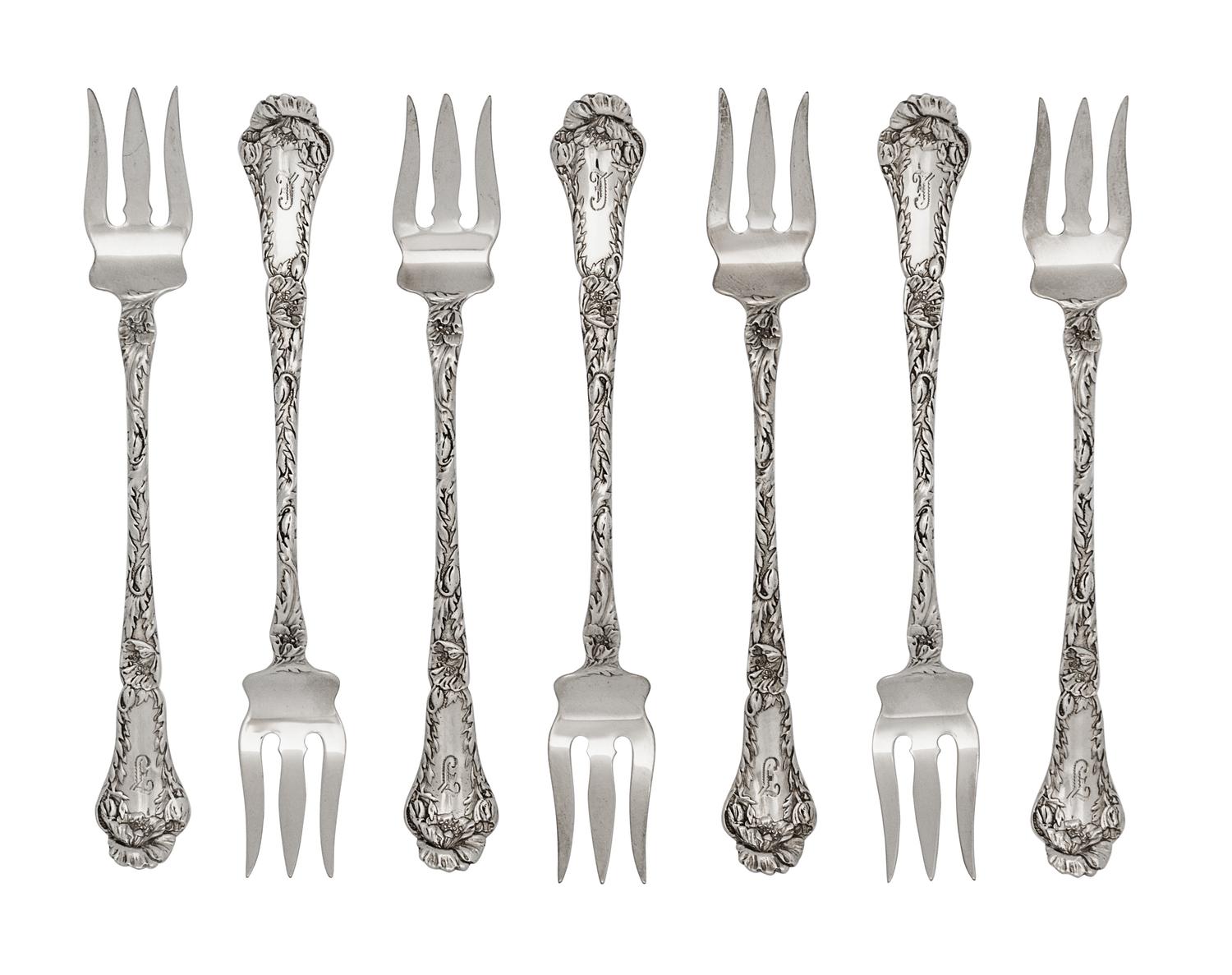 A Set of Twelve American Silver Cocktail Forks, Gorham Mfg. Co., Providence, RI, each with a foliate decorated handle and shaft.