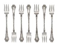 A Set of Twelve American Silver Cocktail Forks, Gorham Mfg. Co., Providence, RI, each with a foliate decorated handle and shaft.