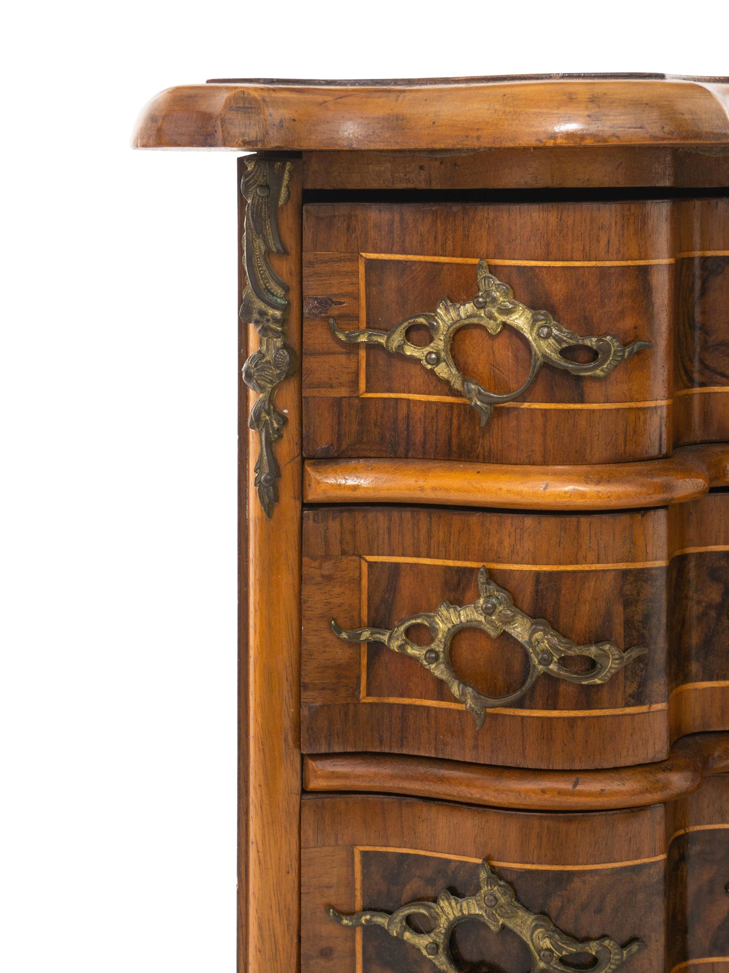 A Louis XV Style Walnut and Kingwood Diminutive Chest of Drawers