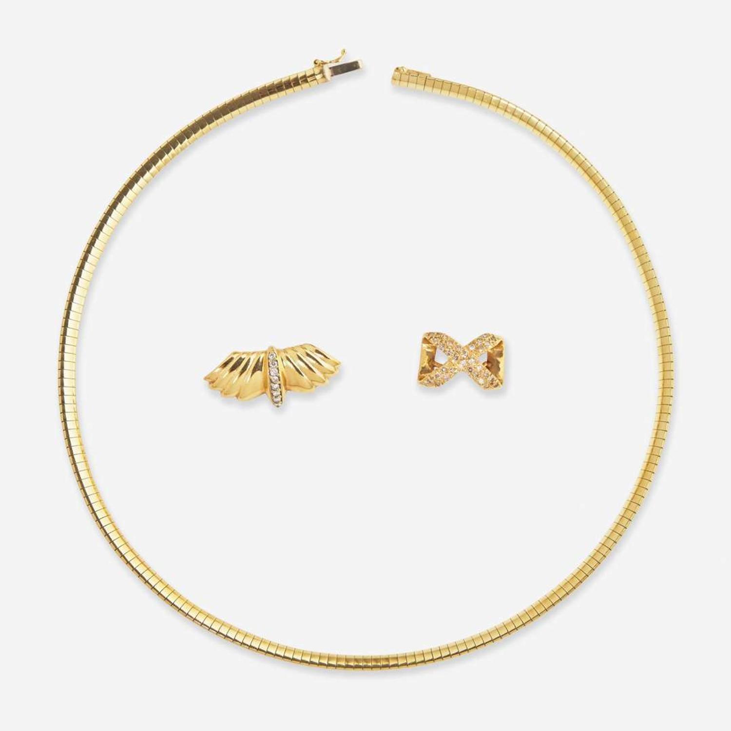 A 14K Yellow Gold Omega Chain and Slider Charms