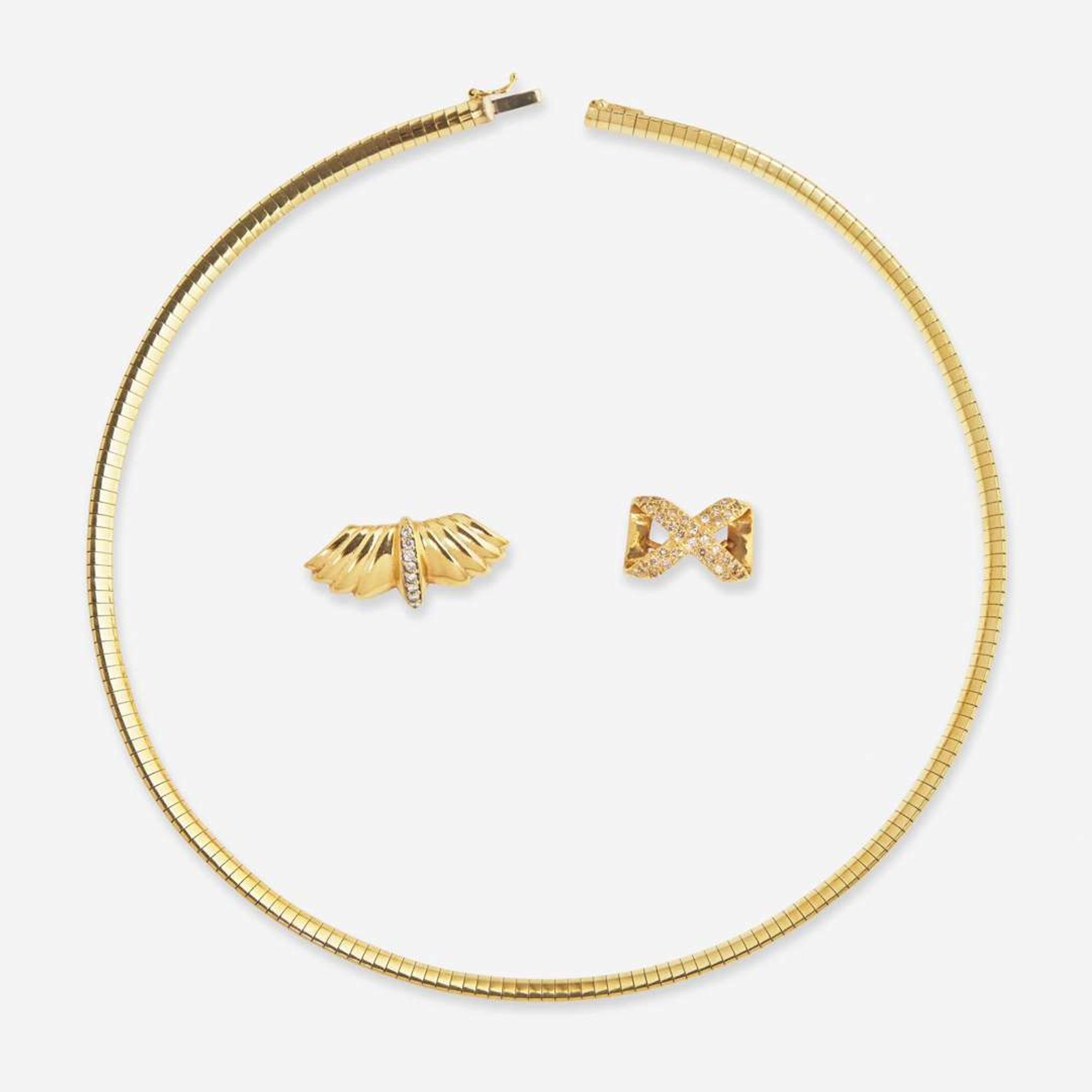 A 14K Yellow Gold Omega Chain and Slider Charms