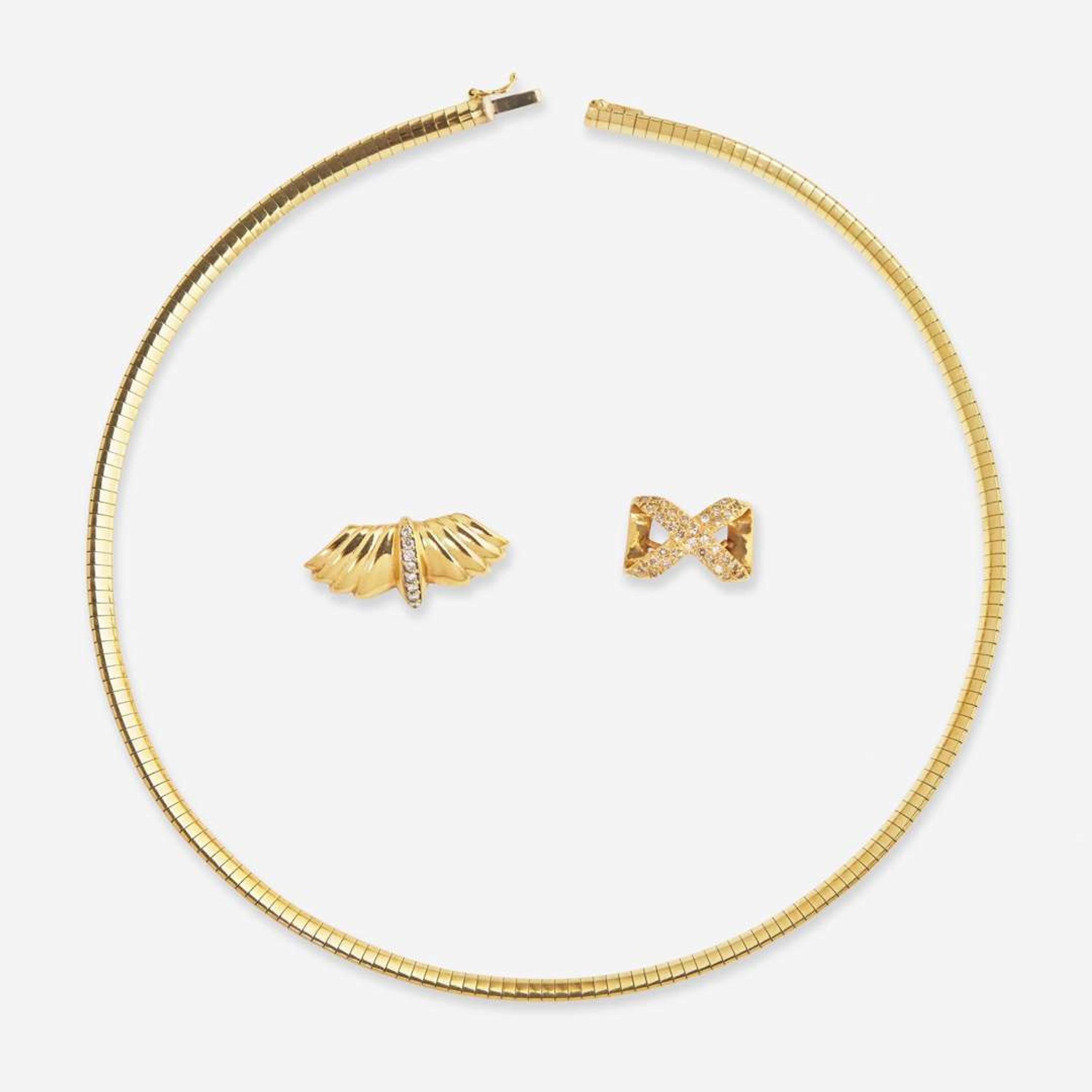 A 14K Yellow Gold Omega Chain and Slider Charms