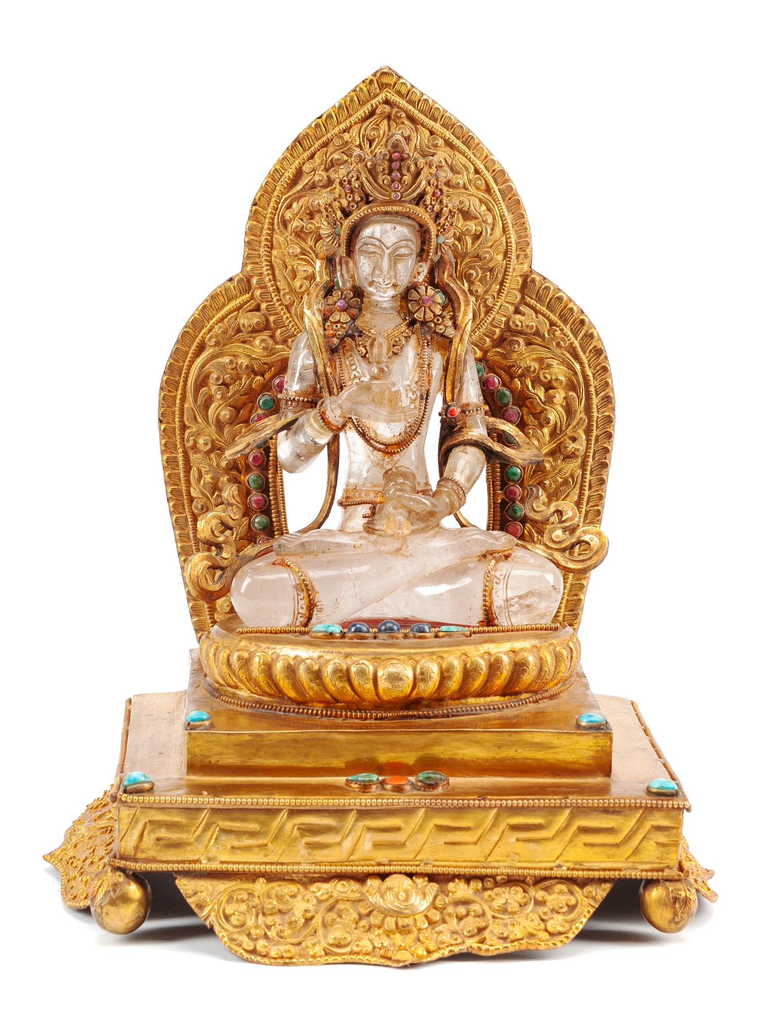 A Gilt Bronze and Rock Crystal Figure of a Seated Deity