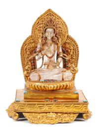 A Gilt Bronze and Rock Crystal Figure of a Seated Deity